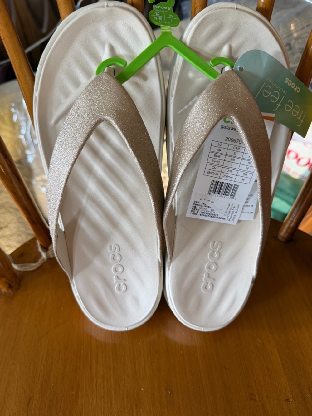 CROCS Women's Glitter Strap Flip Sandals in Champagne and White